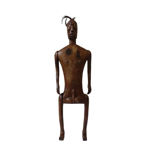 619 - AN AFRICAN ARTICULATED WOODEN MALE FERTILITY FIGURE with tufted hair and bone inset eyes.40 cms... 