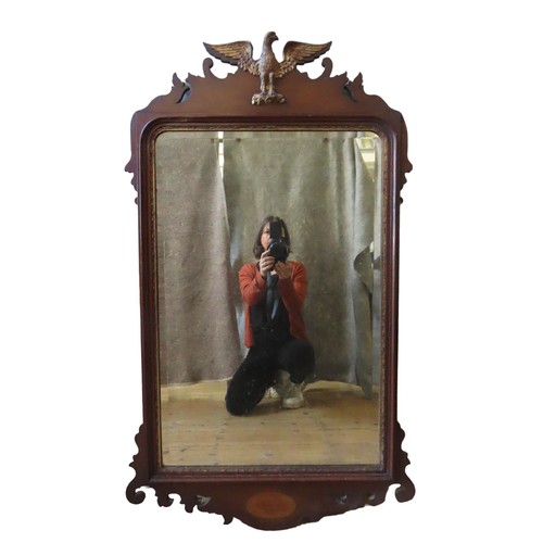 336 - A MAHOGANY FRET CUT PIER MIRROR, 19TH CENTURY, with a bevelled rectangular plate, surmounted by a ca... 