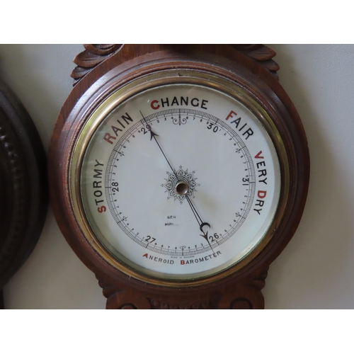 94 - THREE ANEROID BAROMETERS, LATE 19TH/EARLY 20TH CENTURY, two in carved oak banjo form cases, one in a... 