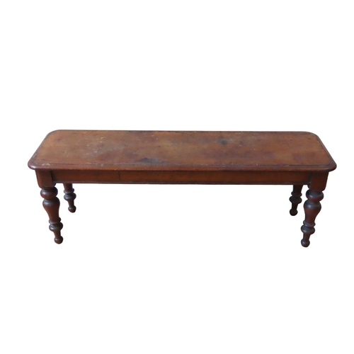 14 - A VICTORIAN MAHOGANY WINDOW SEAT, rectangular moulded edge top raised on four turned baluster legs43... 