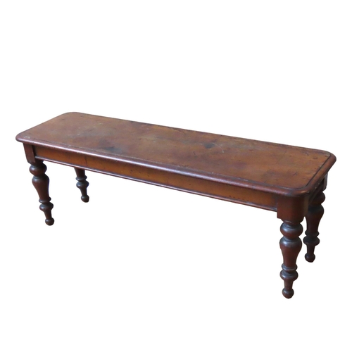 14 - A VICTORIAN MAHOGANY WINDOW SEAT, rectangular moulded edge top raised on four turned baluster legs43... 