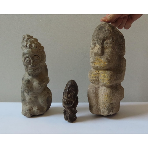 89 - AN AFRICAN CARVED STONE SEATED FIGURE, another African carved stone figure and a smaller example.27 ... 