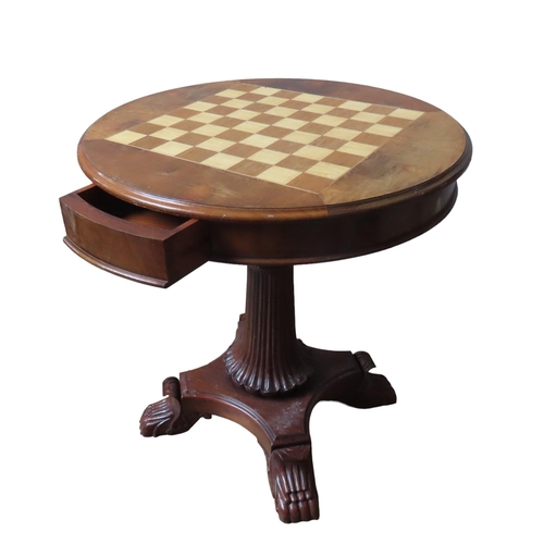 16 - A MAHOGANY GAMES TABLE, 20TH CENTURY, the circular moulded edge top inset with a checkerboard, above... 