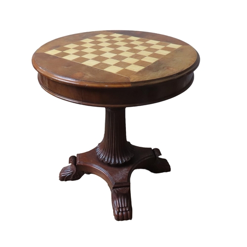 16 - A MAHOGANY GAMES TABLE, 20TH CENTURY, the circular moulded edge top inset with a checkerboard, above... 