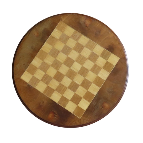 16 - A MAHOGANY GAMES TABLE, 20TH CENTURY, the circular moulded edge top inset with a checkerboard, above... 