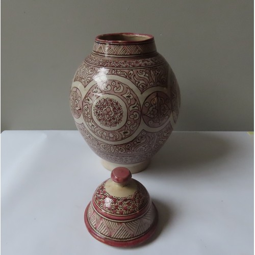 291 - A CERAMIC BALUSTER JAR WITH DOMED COVER  45cm high (A.F)