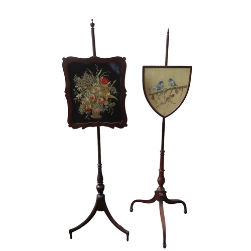 7 - TWO 19TH CENTURY MAHOGANY POLE SCREENS, with shield form and scroll edge panels, one decorated with ... 