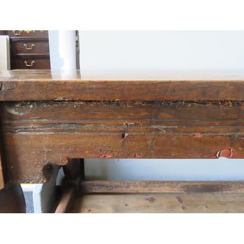 67 - AN 18TH CENTURY OAK REFECTORY TABLE, with quadruple boarded removable top over frieze panels with ru... 