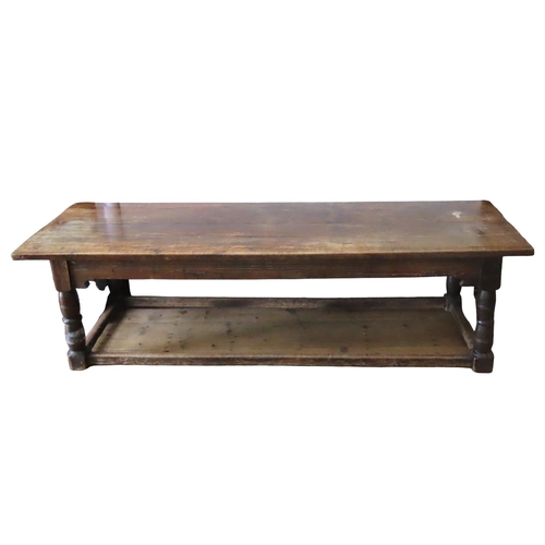 67 - AN 18TH CENTURY OAK REFECTORY TABLE, with quadruple boarded removable top over frieze panels with ru... 