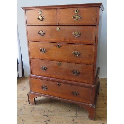 61 - A 19TH CENTURY OAK AND MAHOGANY CHEST ON STAND, comprised of two short over three long graduated cro... 