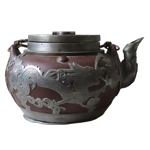 165 - A CHINESE PEWTER MOUNTED YIXING TEAPOT, the sides decorated with scaly dragons (9 cm high)together w... 