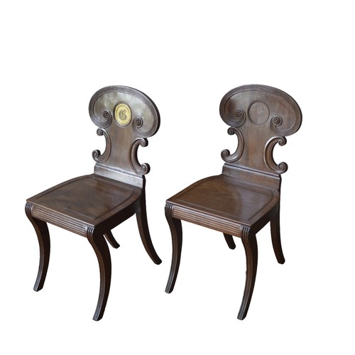 10 - A PAIR OF 19TH CENTURY MAHOGANY HALL CHAIRS, IN THE MANNER OF GILLOWS, elegant arch top scrolling ba... 