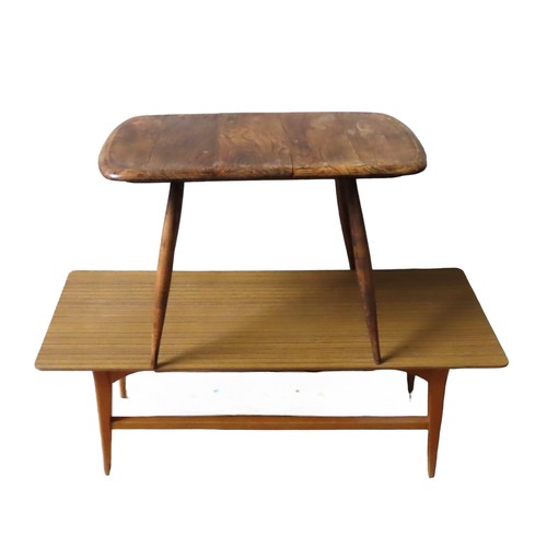 5 - AN ERCOL MODEL 213 OCCASIONAL TABLE, curved edge rectangular elm top on tapering beech legs (48 x 68... 