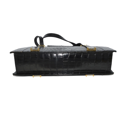 284 - BLACK CROCODILE SKIN STRUCTURED HAND BAG with two large inner compartments and a third large zipped ... 