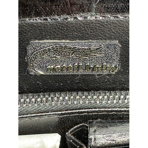 284 - BLACK CROCODILE SKIN STRUCTURED HAND BAG with two large inner compartments and a third large zipped ... 