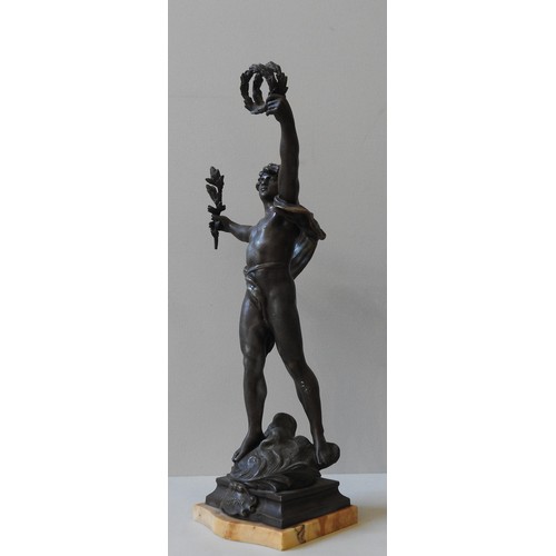 582 - A BRONZE FIGURE OF A FOOTBALL PLAYER, MID 20TH CENTURY, modelled naturalistically, about to strike t... 