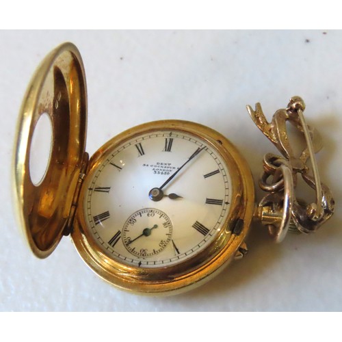 603 - AN EDWARDIAN GOLD HALF HUNTER FOB WATCH, the blue enamel mounted cover opening to reveal a 25 mm whi... 