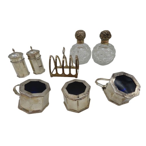 681 - A MATCHING SET OF VINTAGE SILVER MUSTARD POTS, PEPPERETTES AND SALT, octagonal form with domed cover... 