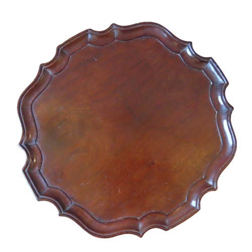 31 - A 19TH CENTURY MAHOGANY WINE TABLE, the circular top with pie crust edge, raised on a tapering turne... 