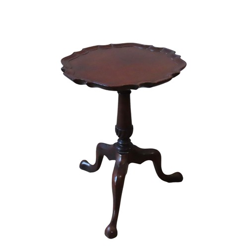 31 - A 19TH CENTURY MAHOGANY WINE TABLE, the circular top with pie crust edge, raised on a tapering turne... 