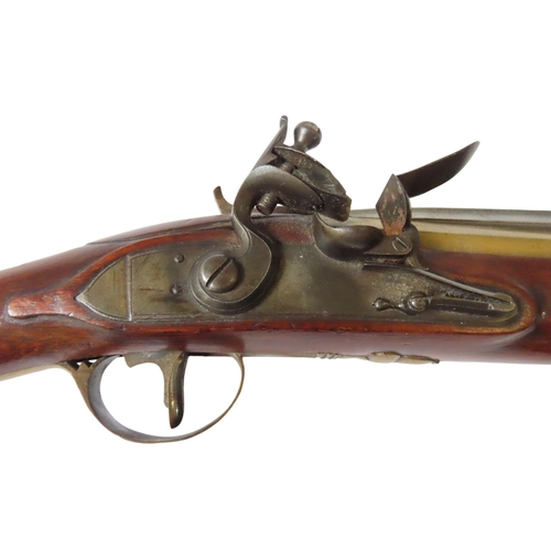 245 - A FLINTLOCK COACHING BLUNDERBUSS C1800, unnamed, with top folding bayonet, the brass flared barrel s... 