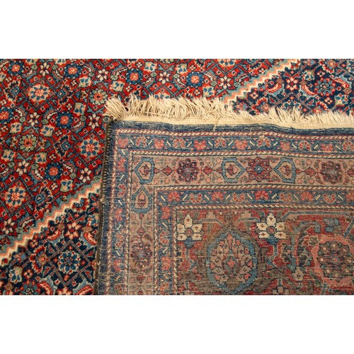 157 - A LARGE HAND WOVEN BIDJAR CARPET, central lozenge form medallion enclosed by alternating red and blu... 