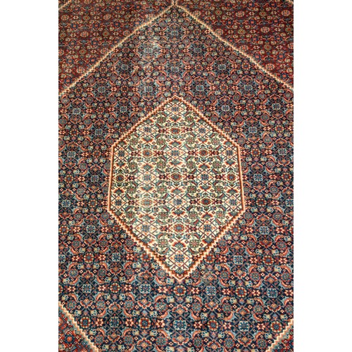 157 - A LARGE HAND WOVEN BIDJAR CARPET, central lozenge form medallion enclosed by alternating red and blu... 