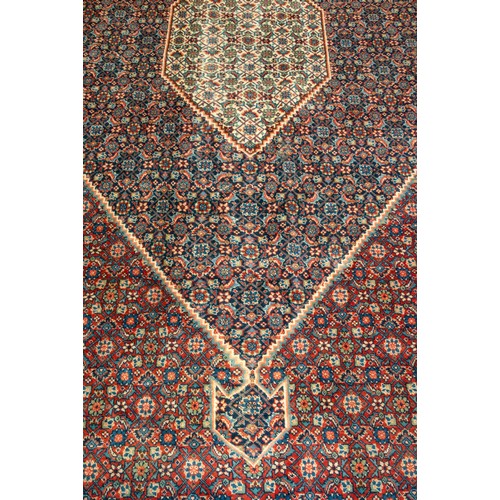 157 - A LARGE HAND WOVEN BIDJAR CARPET, central lozenge form medallion enclosed by alternating red and blu... 