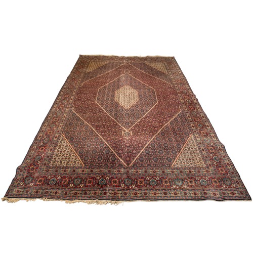 157 - A LARGE HAND WOVEN BIDJAR CARPET, central lozenge form medallion enclosed by alternating red and blu... 