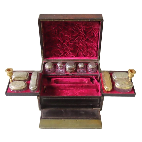 218 - A ROSEWOOD AND BRASS BOUND VANITY BOX, 19TH CENTURY, by Austin of Dublin, with a fall front panel, s... 