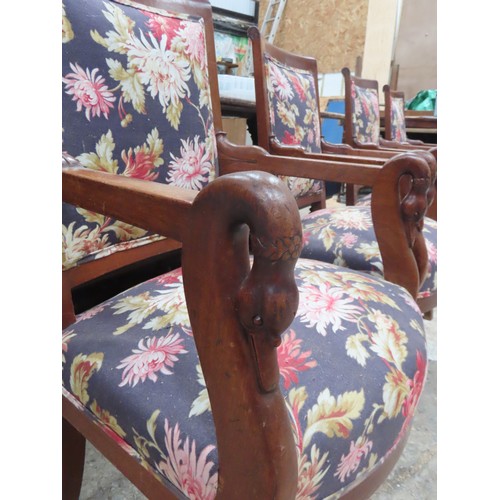 65 - A SET OF FOUR FRENCH EMPIRE ARMCHAIRS, the back and seat panels covered in a vibrant floral patterne... 