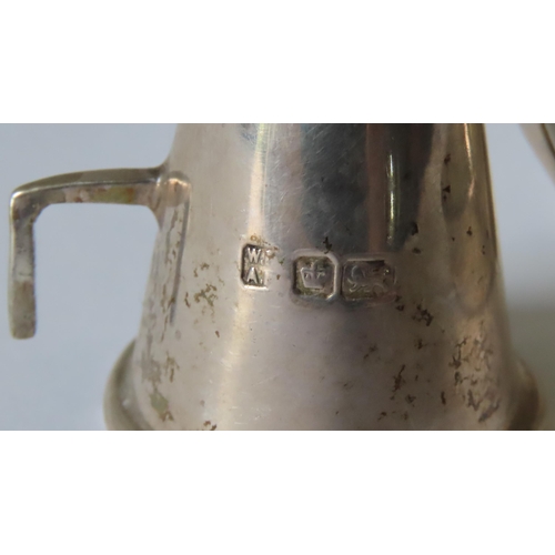 655 - AN EDWARDIAN SILVER CHAMBERSTICK, with a crown form sconce raised on an octagonal pillar, on a circu... 