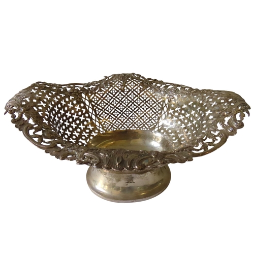 700 - A GEORGE III SILVER OVAL FORM BREAD BASKET, with ornate pierced sides and repousse edge with scrolli... 