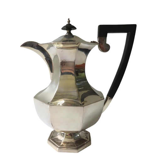 702 - A VINTAGE SILVER COFFEE POT, octagonal waisted form, with ebonised handle and finial, bears the mark... 