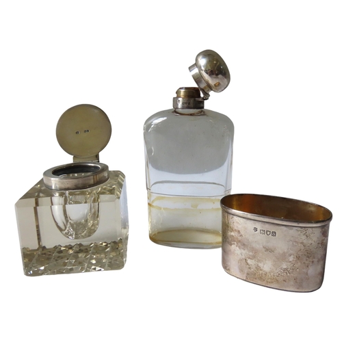 629 - A VINTAGE SILVER MOUNTED HIP FLASK AND INKWELL, the glass flask with a hinged globular lid and cup b... 