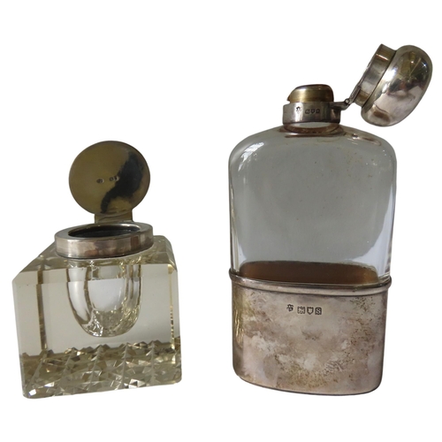 629 - A VINTAGE SILVER MOUNTED HIP FLASK AND INKWELL, the glass flask with a hinged globular lid and cup b... 