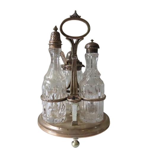 692 - AN EARLY VICTORIAN SILVER CRUET FRAME, stamped, containing three silver mounted bottles, stamped 'La... 