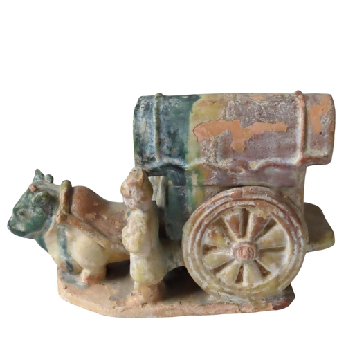 329 - A SANCAI GLAZED OX-DRAWN CARRIAGE GROUP, in the Ming Dynasty style, the canopied carriage modelled w... 