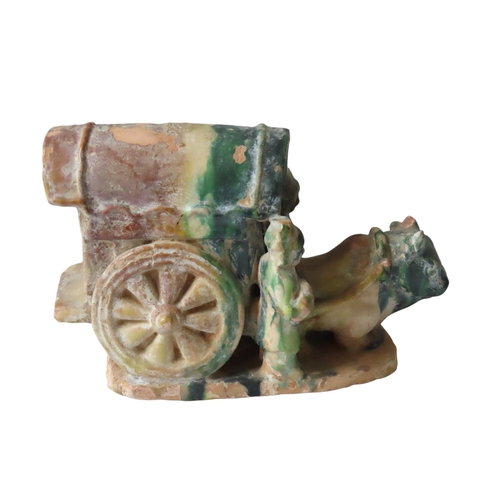 329 - A SANCAI GLAZED OX-DRAWN CARRIAGE GROUP, in the Ming Dynasty style, the canopied carriage modelled w... 