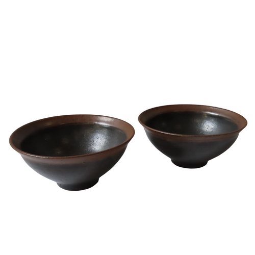 323 - A PAIR OF CHINESE GLAZED POTTERY BOWLS, 19TH/20TH CENTURY, in the Song Dynasty style6.5 cm x 14 cm d... 