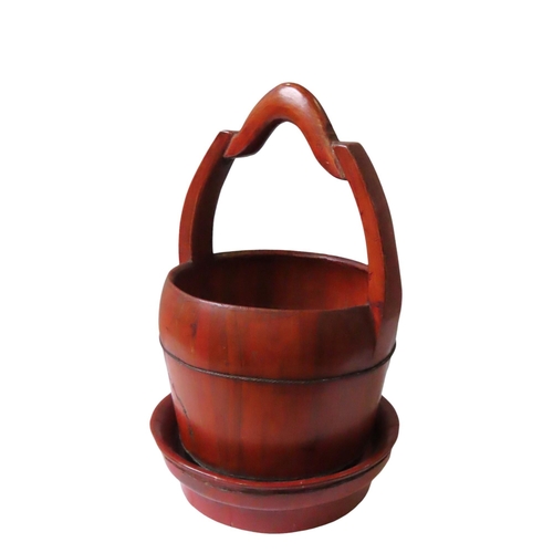 129 - A CHINESE BAMBOO PAIL AND A LACQUERED CIRCULAR STAND, the tapering form pail with serpentine handleP... 