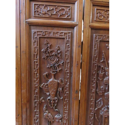 127 - A GROUP OF FIVE CHINESE CARVED HARDWOOD PANELS, the panels with relief carved decoration depicting f... 