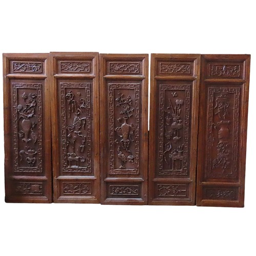 127 - A GROUP OF FIVE CHINESE CARVED HARDWOOD PANELS, the panels with relief carved decoration depicting f... 