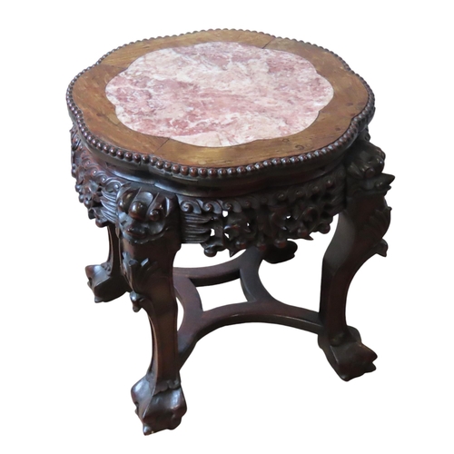 116 - A CHINESE MARBLE INSET HARDWOOD URN STAND, lobed form circular top with beaded edge, above an ornate... 