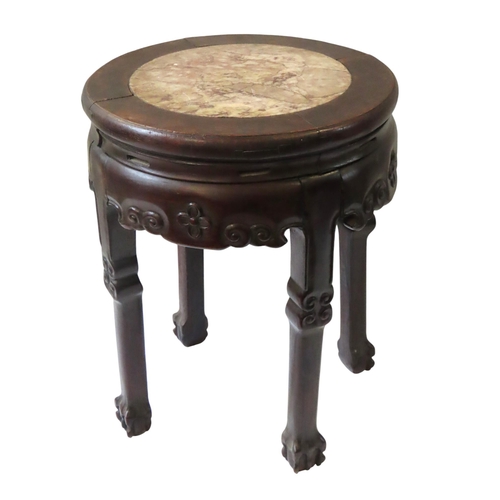 114 - A CHINESE HARDWOOD MARBLE INSET URN STAND, circular form with scroll carved pierced frieze, raised o... 