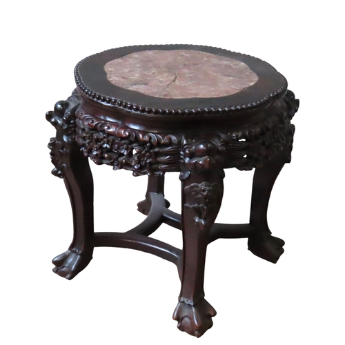 119 - A CHINESE HARDWOOD MARBLE INSET STAND, the lobed circular top with beaded edge above a pierced friez... 