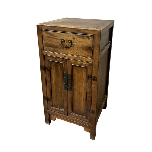 120 - A CHINESE HARDWOOD PANELLED SIDE CABINET, of square form, with a single frieze drawer over panelled ... 