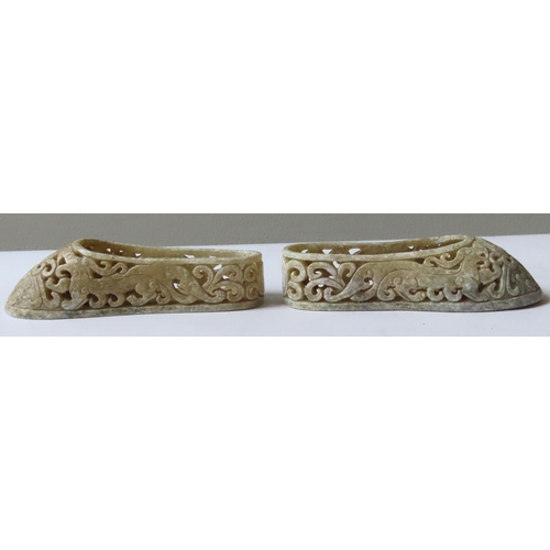 358 - A PAIR OF CHINESE HARDSTONE MINIATURE HANFU SHOES, the sides carved with dragons and pierced scroll ... 