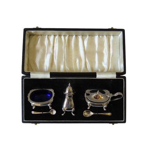 635 - A SILVER CRUET SET IN PRESENTATION BOX, consisting of salt, mustard pot and pepperette, with two sma... 