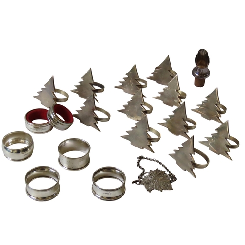 624 - FOUR SILVER NAPKIN RINGS, DECANTER LABEL AND BOTTLE RING, together with twelve plated napkin rings, ... 